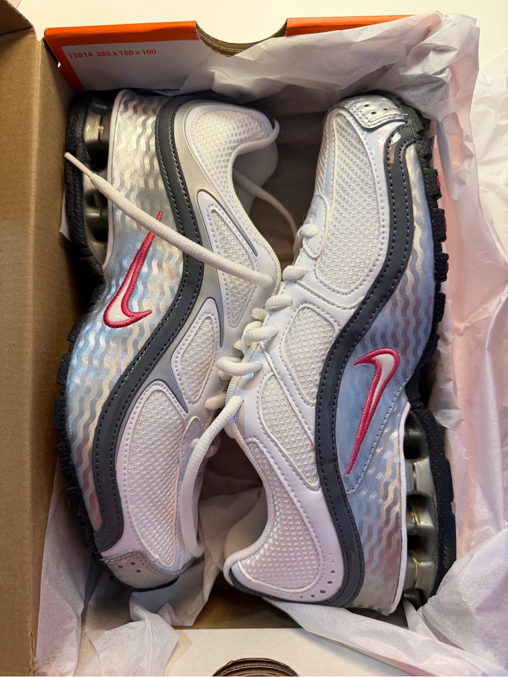 Nike women’s Reax Run 5 Sneakers in White and Silver